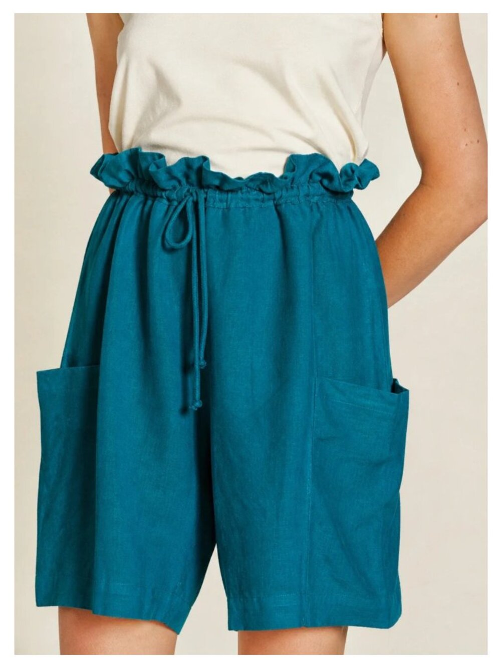 BLACK CRANE Parachute Shorts in Teal $325